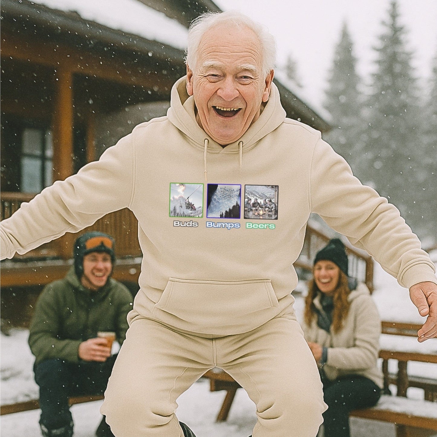 Sand hoodie with Buds Bumps Beers design, worn by an older skier goofing around outside a snowy lodge with friends après-ski.