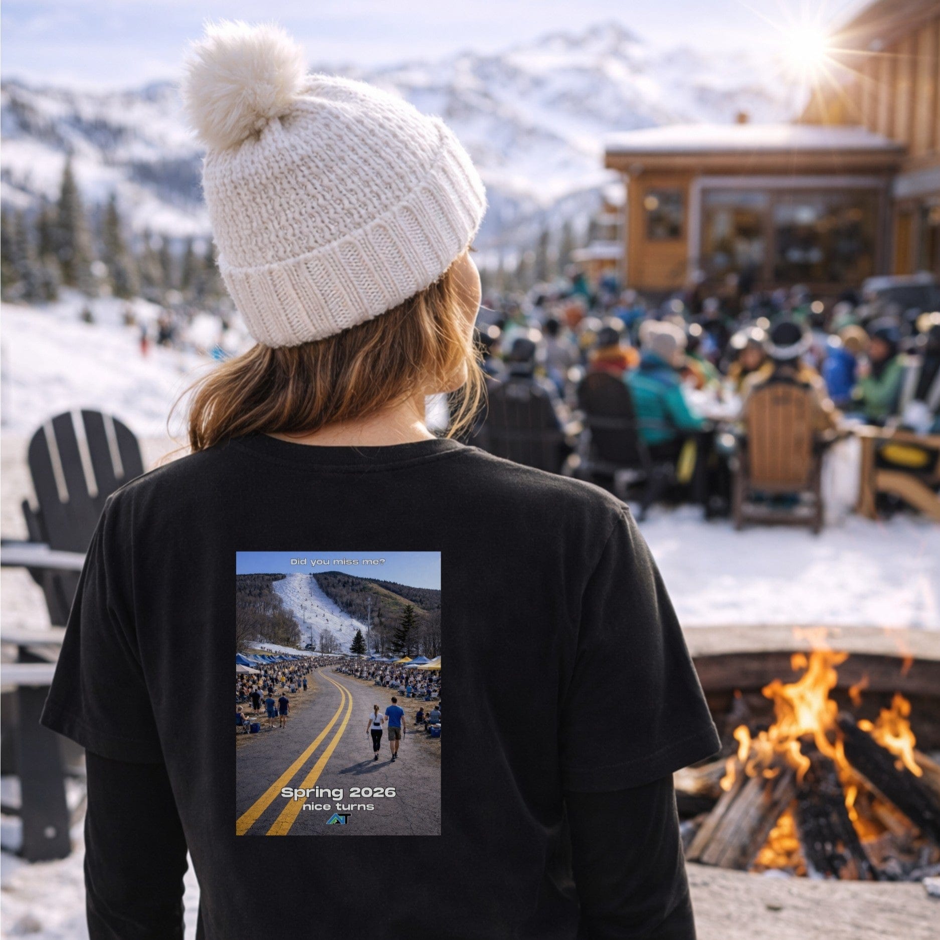 Female skier wearing black glacier t-shirt back view at outdoor après firepit