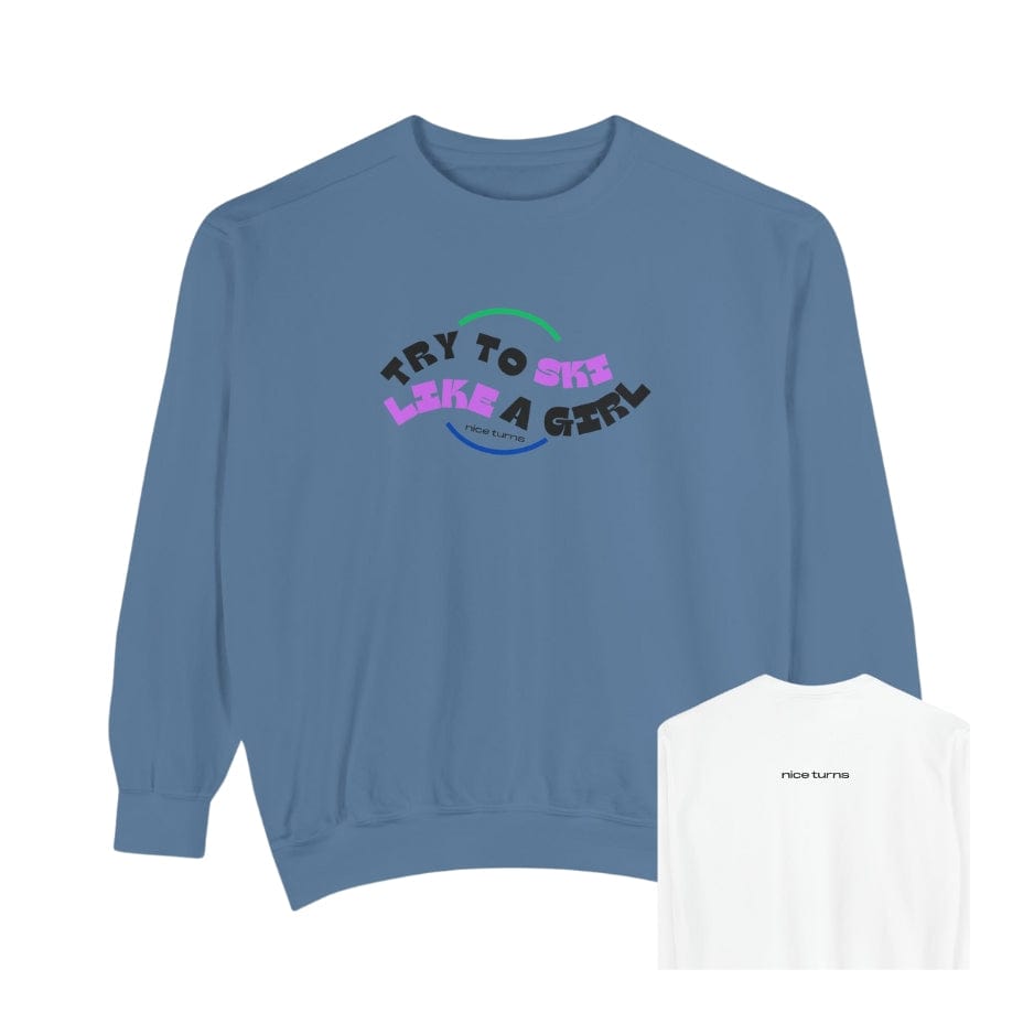 Front and back view of blue crewneck sweatshirt from the “Try to Ski Like a Girl” collection, featuring curved retro-style lettering on front and small “nice turns” logo on back neck; Freida Ridge color.