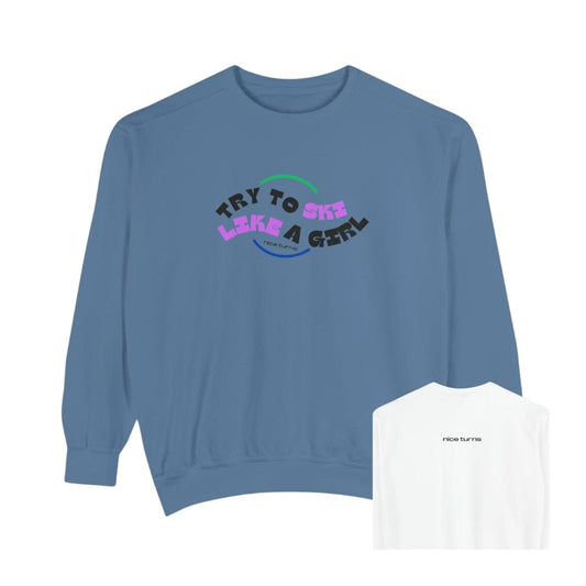 Front and back view of blue crewneck sweatshirt from the “Try to Ski Like a Girl” collection, featuring curved retro-style lettering on front and small “nice turns” logo on back neck; Freida Ridge color.